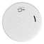 Battery powered, low profile, smoke alarm with replaceable battery and silence feature